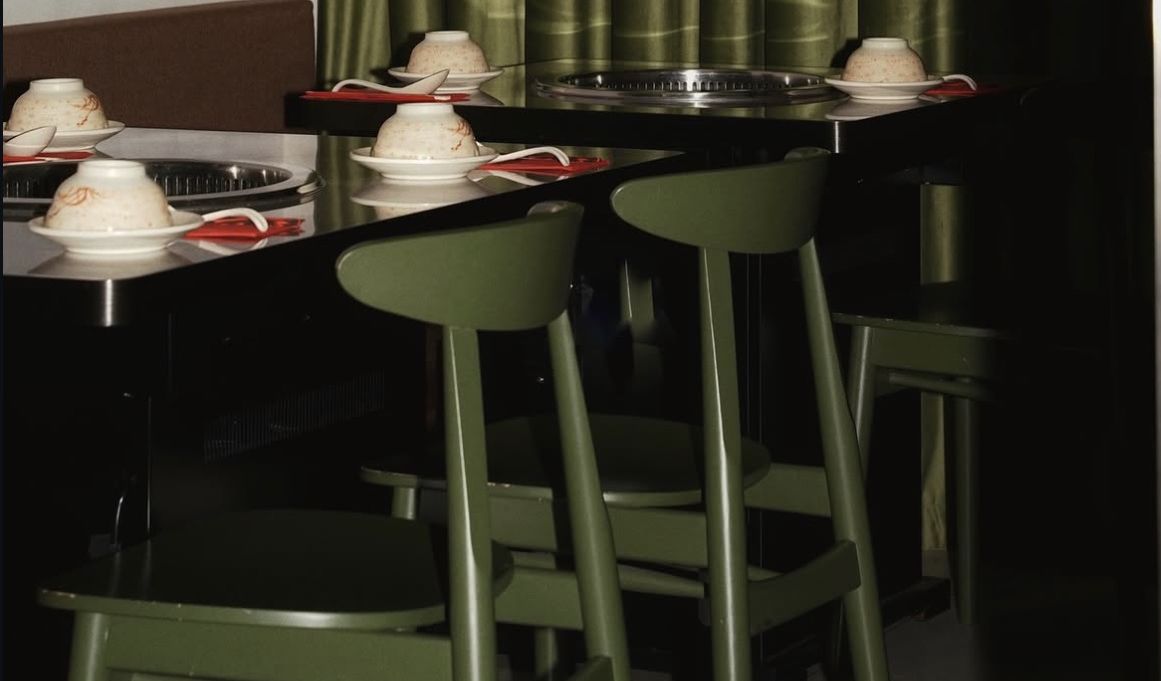 Green chairs at the counter