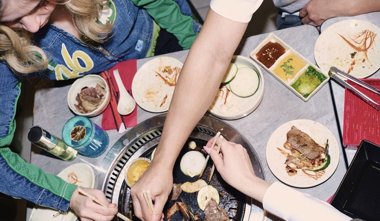 Friends cooking at the table
